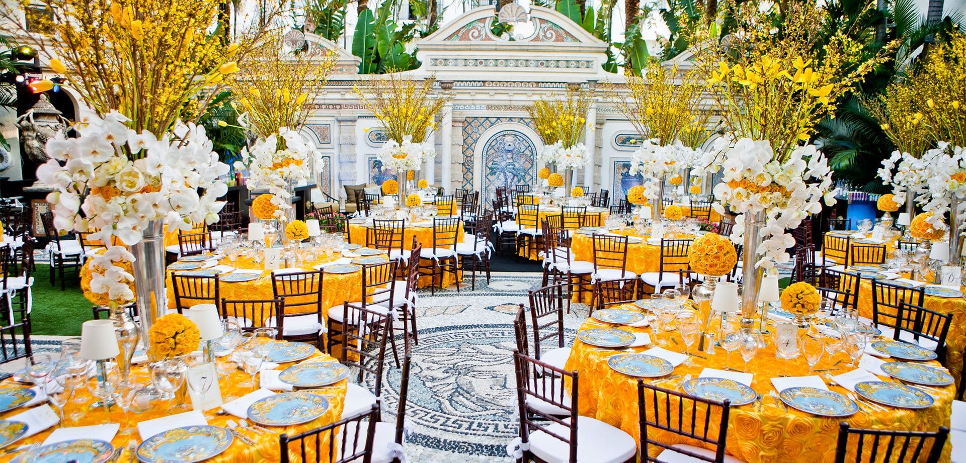 Barton-G-hero-background A dinner setup with an orange and white color scheme